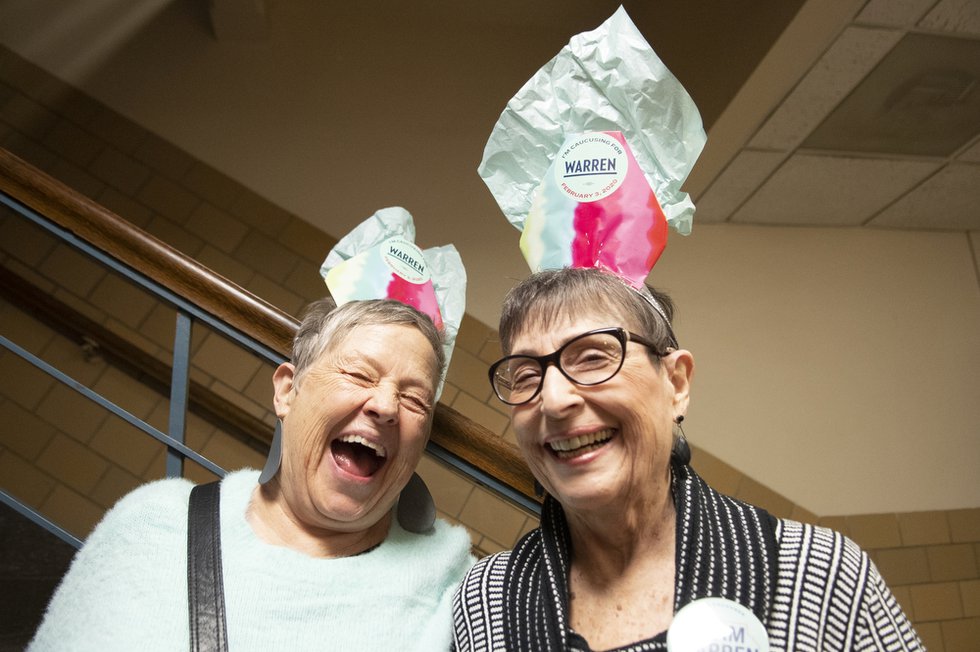 Warren supporters Lou Cathcart (left) and Phyllis Boone in the hallway at the caucus site in Ames, Iowa.