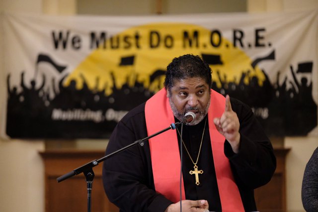 Rev. Dr. William J. Barber II speaks at We Must Do M.O.R.E. tour stop in Des Moines on January 15, 2020, photo by Steve Pavey.jpeg