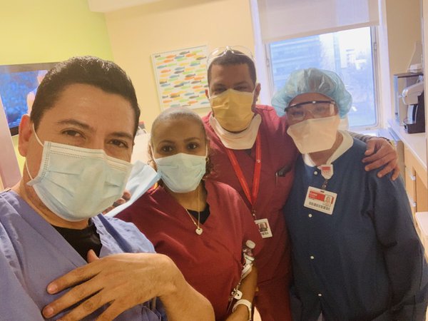 Erasmo Ramos (left), with clean-up crew, at New York-Presbyterian Morgan Stanley Children's Hospital, April 2020, photo provided..jpg