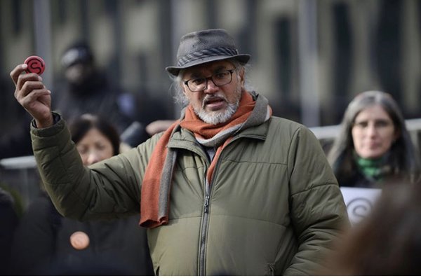 Ravi Ragbir, holding a New Sanctuary Coalition button, after a check-in with ICE on January 24, 2020 in New York City, photo by Meryl Ranzer.jpeg