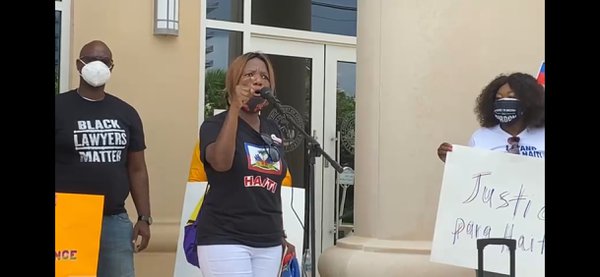 Anne Pierre addresses rally in West Palm Beach, Florida to protest mistreatment of Haitians at the Southern border, photo by Jude Derisme.jpeg