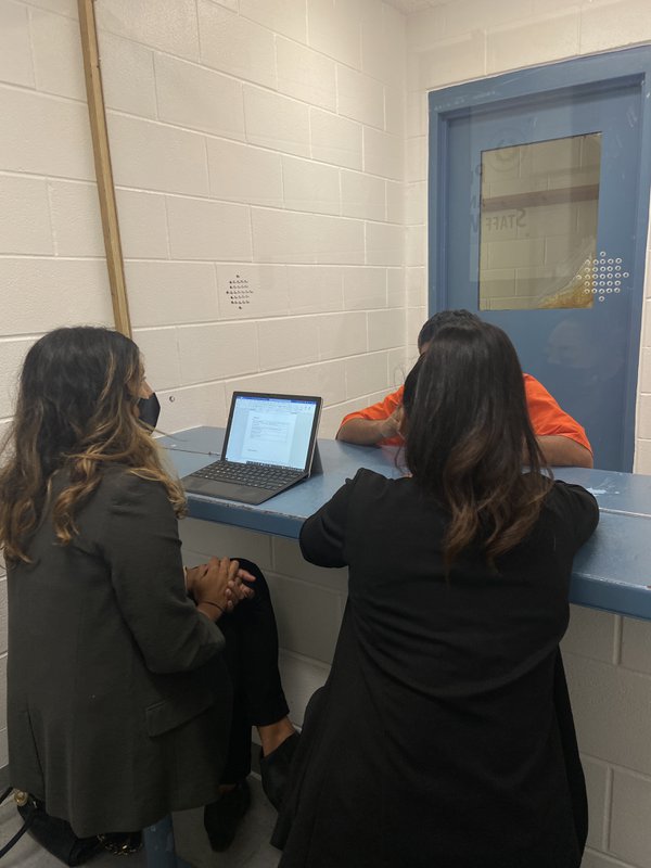 Amrutha Jindal (left), chief defender of Restoring Justice with client at Briscoe Unit of Texas prison system, photo credit Restoring Justice.JPG