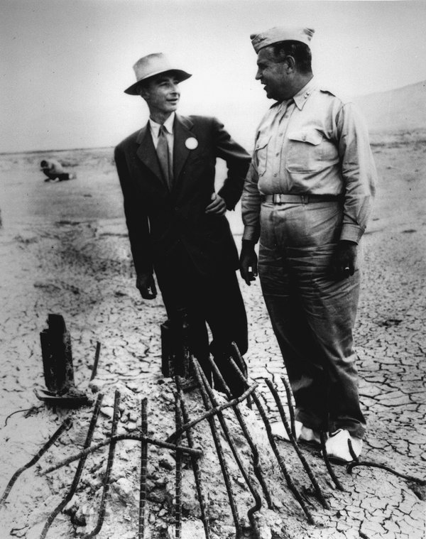 Robert_Oppenheimer_(left)_and_General_Leslie_Groves_(right)_at_Ground_Zero_of_the_nuclear_bomb_test_site.jpeg