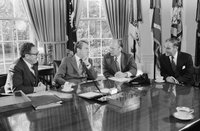 President_Richard_Nixon_seated_at_his_Oval_Office_desk_during_a_meeting_with_Henry_Kissinger,_Alexander_Haig,_and_Gerald_Ford.jpeg