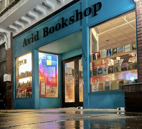 Reflective colors in puddles book balloon by night - Janet Geddis Avid Bookshop.jpeg
