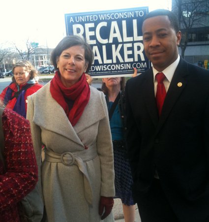 Former Dane County executive Kathleen Falk and Wisconsin Firefighters Association president Mahlon Mitchell on the march to file the papers kicking off the recall effort at the GAB